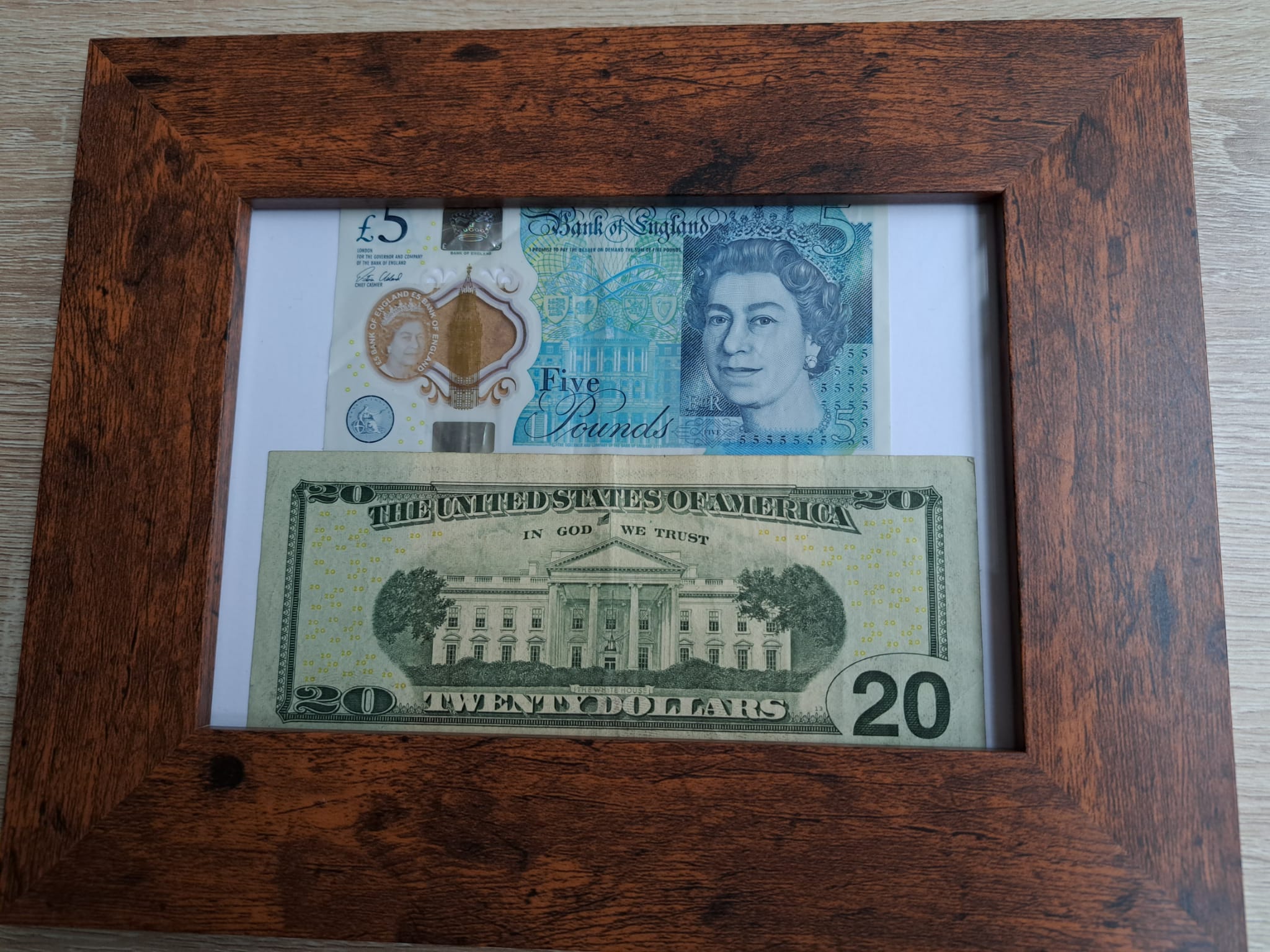 $20 and a five pound note